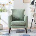 Sillón tapizado verde 26.77 con patas de madera maciza