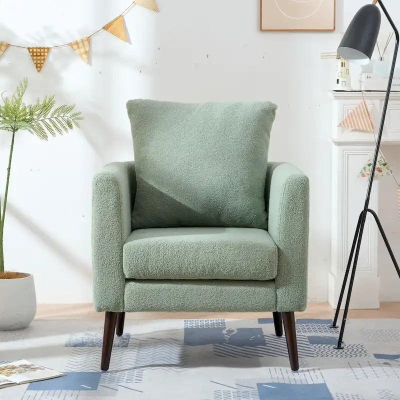 Sillón tapizado verde 26.77 con patas de madera maciza
