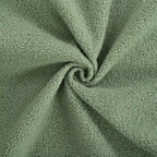 Sillón tapizado verde 26.77 con patas de madera maciza