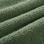 Sillón tapizado verde 26.77 con patas de madera maciza