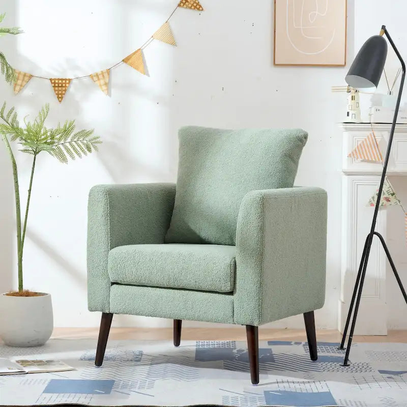 Sillón tapizado verde 26.77 con patas de madera maciza