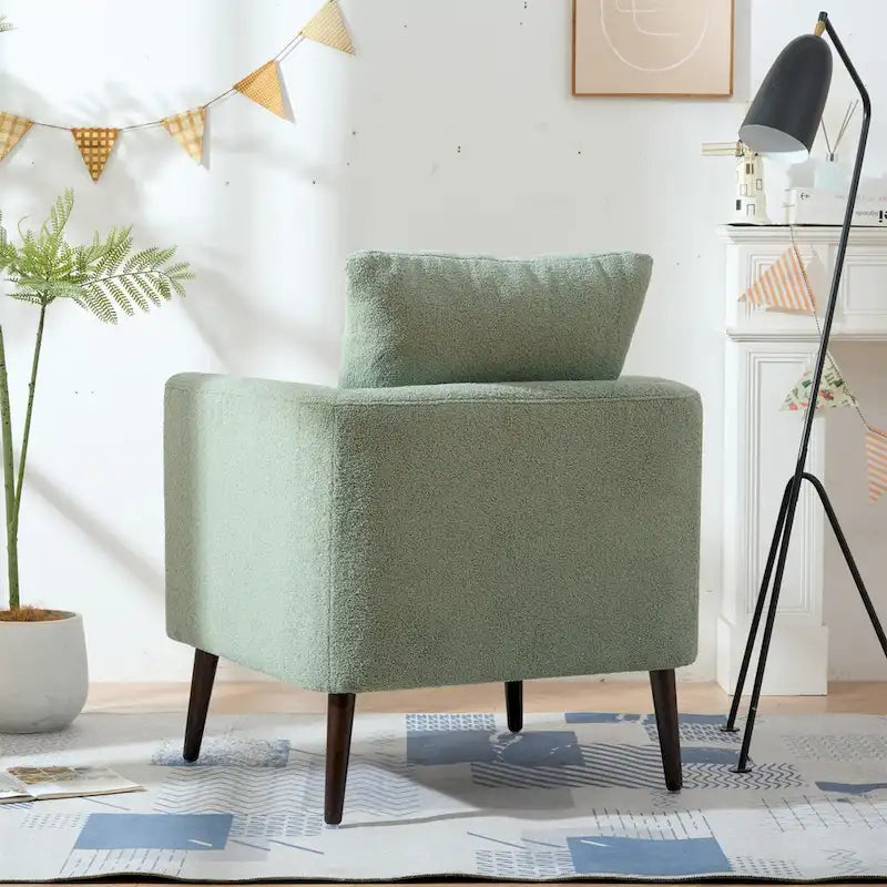 Sillón tapizado verde 26.77 con patas de madera maciza