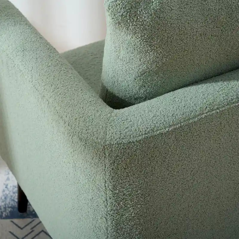 Sillón tapizado verde 26.77 con patas de madera maciza