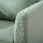 Sillón tapizado verde 26.77 con patas de madera maciza