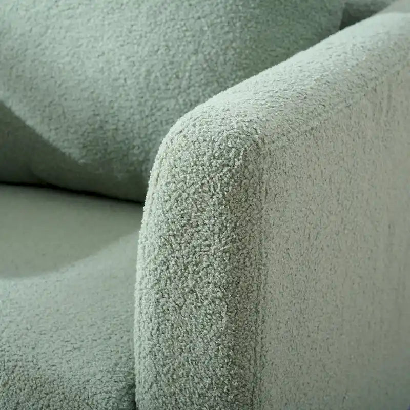 Sillón tapizado verde 26.77 con patas de madera maciza