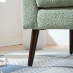 Sillón tapizado verde 26.77 con patas de madera maciza